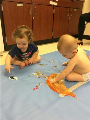 M and K exploring wet, cold, soft, orange, white...PAINT! 